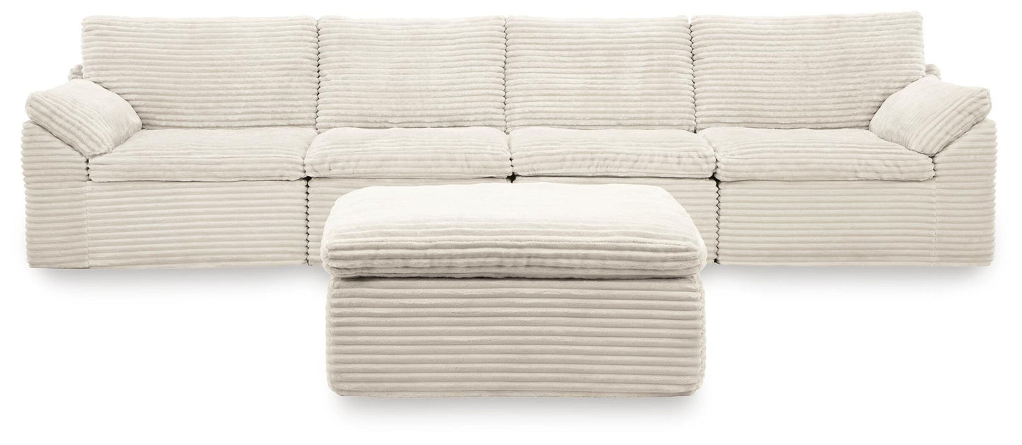 Canefield - 4-Piece Sectional With Ottoman - Ivory