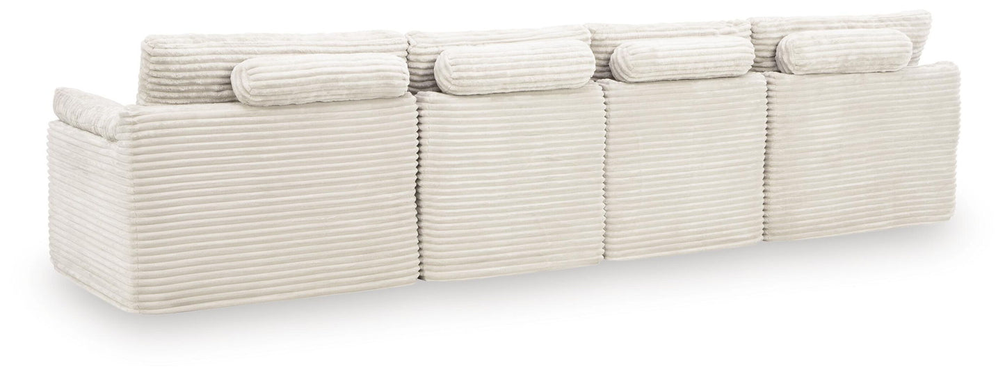 Canefield - 4-Piece Sectional With Ottoman - Ivory